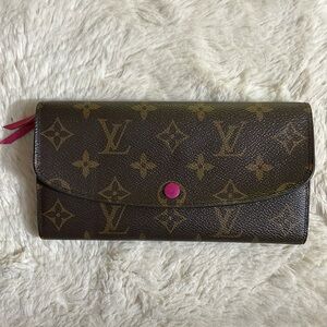 Authentic Louis Vuitton monogram wallet preowned with pink interior